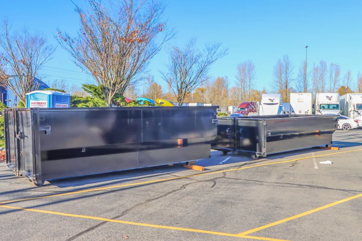 Professional dumpster rental service with roll-off container on residential driveway in Horizon City